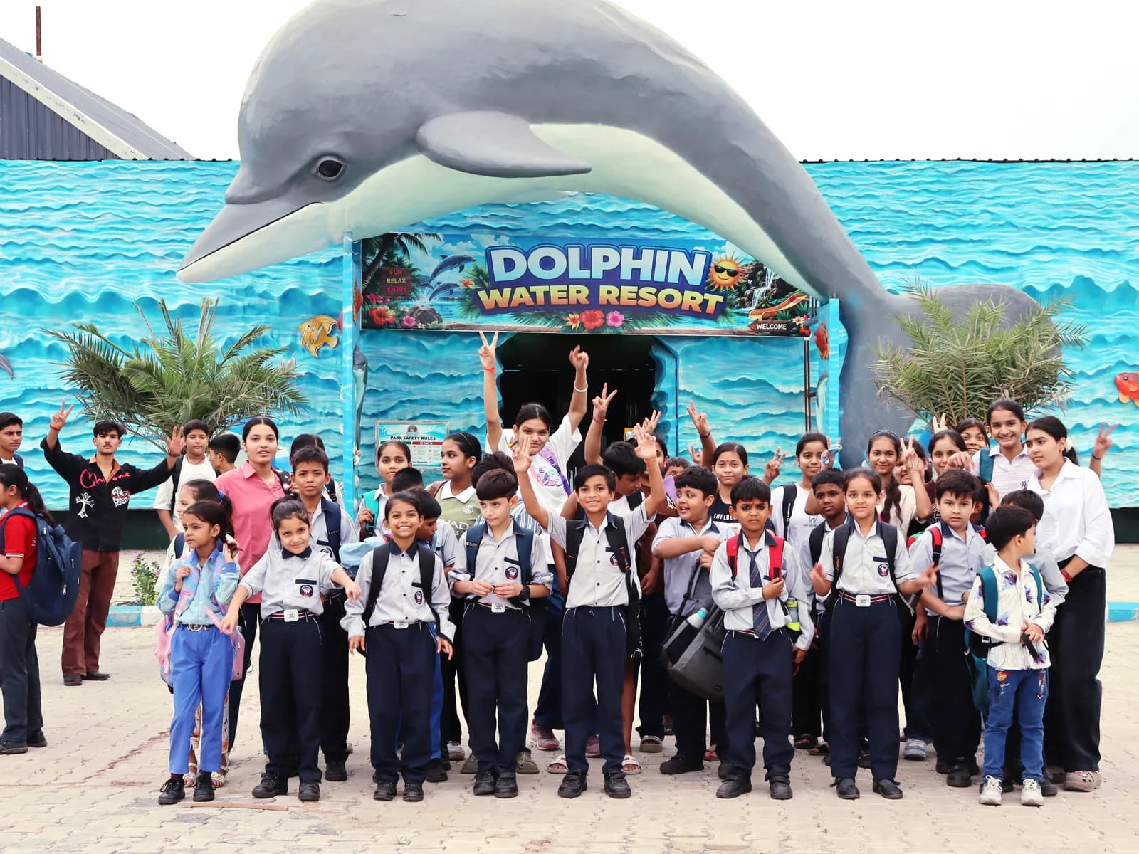 A school group with their teachers at the Dolphin Water Resort entrance