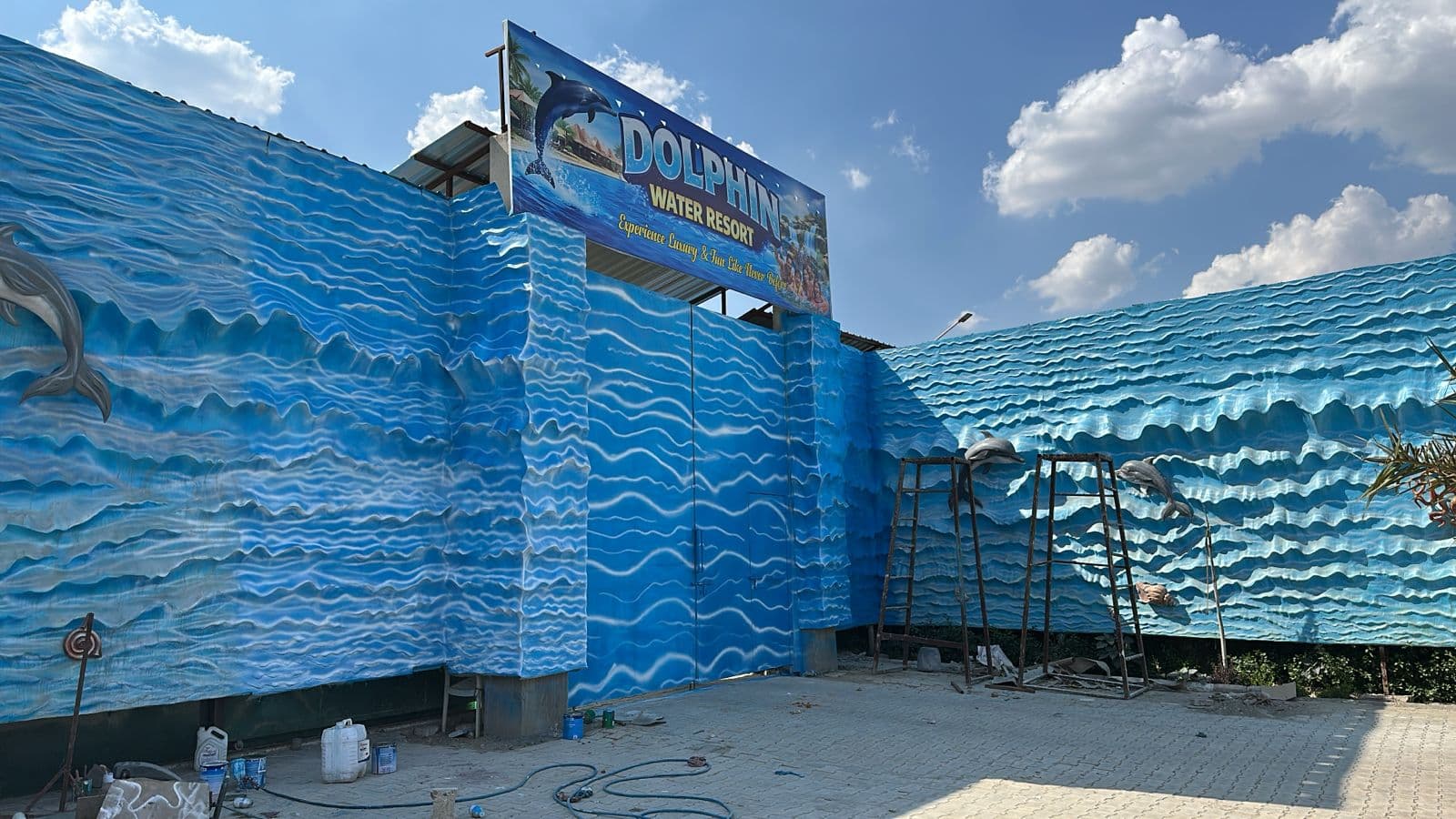 Dolphin Water Resort building exterior with wave mural